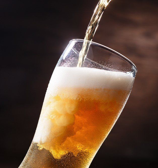 Pouring a pint of beer into a glass